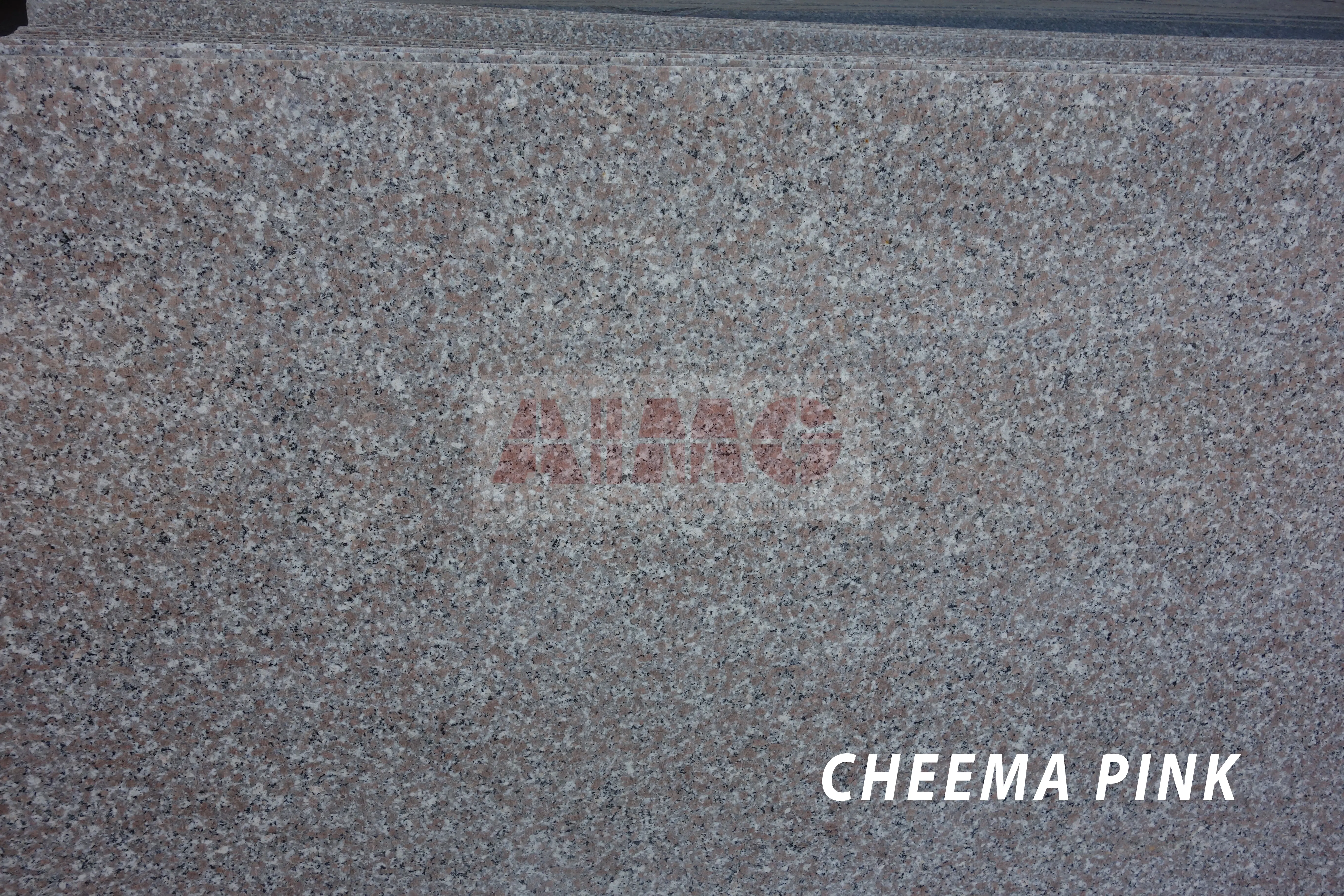 Cheema Pink Granite slab by Aravali Marbles with uniform pink and grey grain patterns for durable modular kitchen countertops