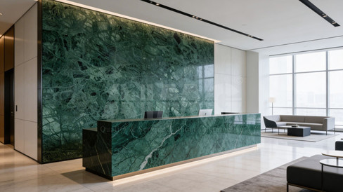 Reception desk and feature wall in Verde Guatemala marble for contemporary interior by Aravali Marbles