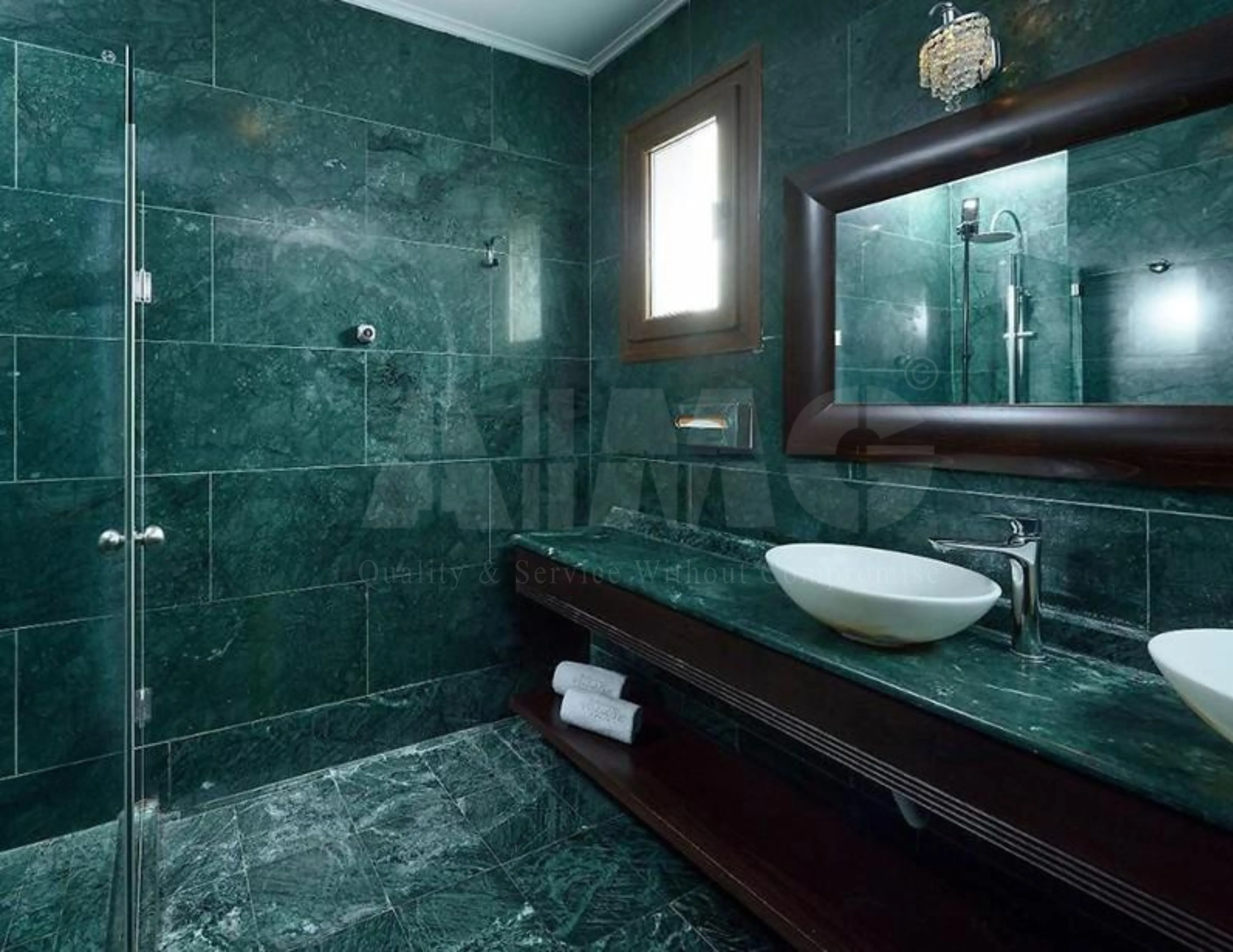 Luxury green marble bathroom by Aravali Marbles featuring polished green marble wall cladding, flooring, and vanity countertops with elegant natural veining.
