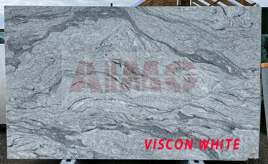 Viscon White Granite slab by Aravali Marbles showcasing flowing grey textures ideal for contemporary kitchen countertops and flooring