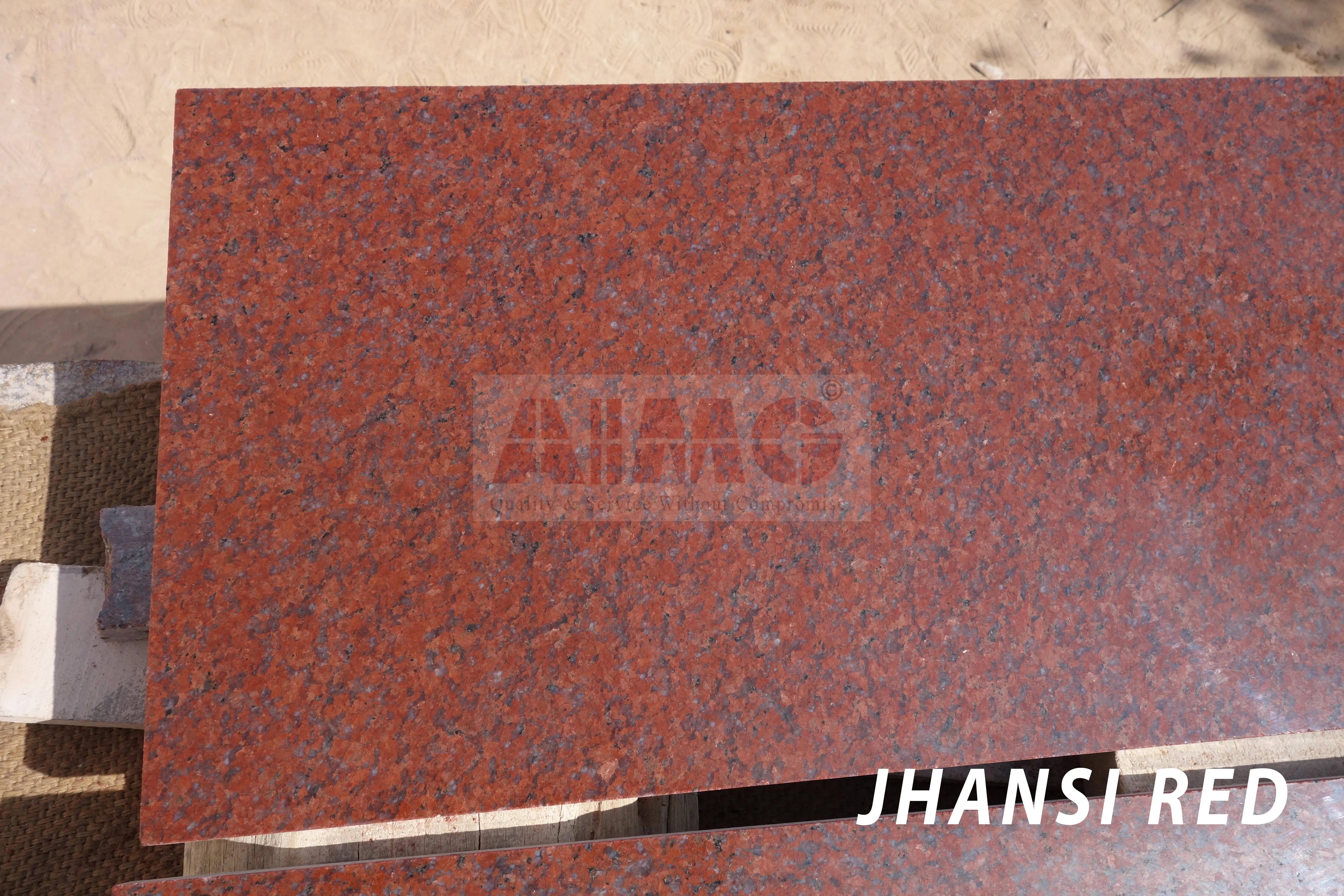 Jhansi Red Granite slab by Aravali Marbles with rich uniform red texture ideal for durable kitchen counter applications