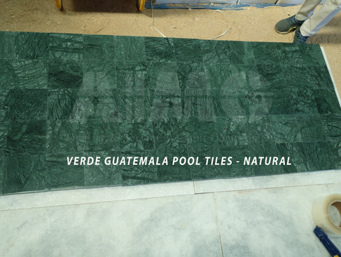 Verde Guatemala marble tiles laid for flooring or pool area with smooth natural finish