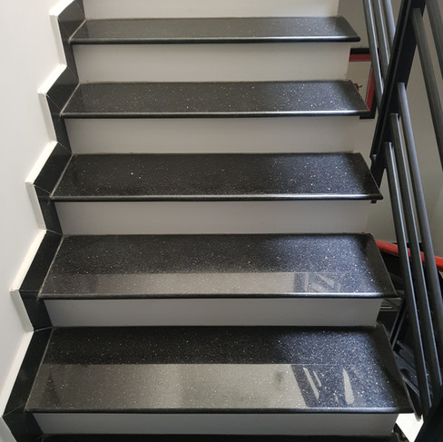 Black Galaxy granite treads and risers with bullnose edge finish