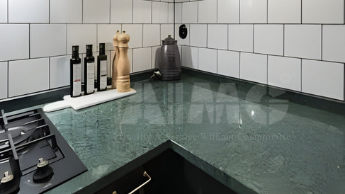 Close-up of Verde Guatemala marble kitchen countertop and corner detailing by Aravali Marbles