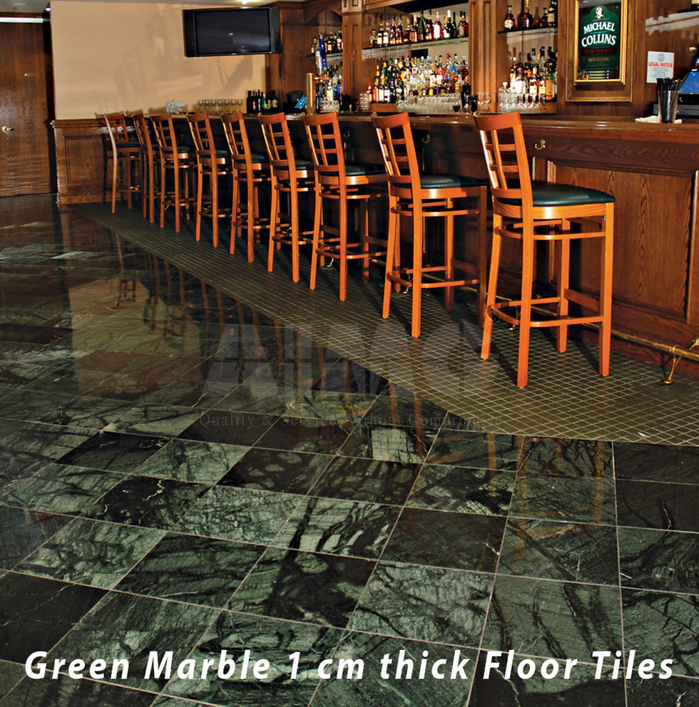 Premium Green Marble 1 cm thick floor tiles installed in a luxury bar and hospitality setting, showcasing deep emerald-green tones, dramatic natural veining, and a polished finish. Sourced and supplied by Aravali Marbles, these durable green marble floor tiles bring elegance, strength, and timeless appeal to commercial and residential interiors.