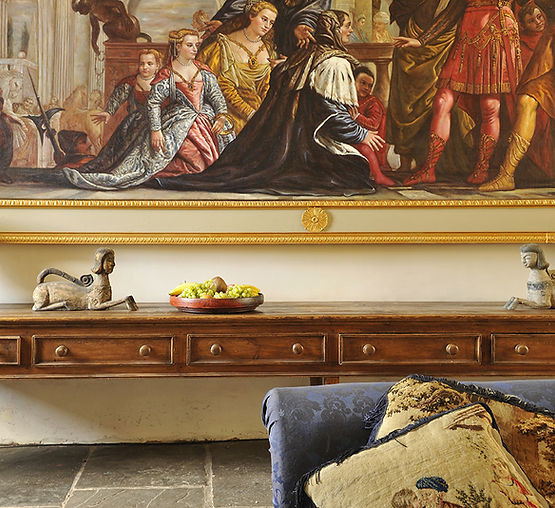 Antique interior with framed artwork and decorative furnishings