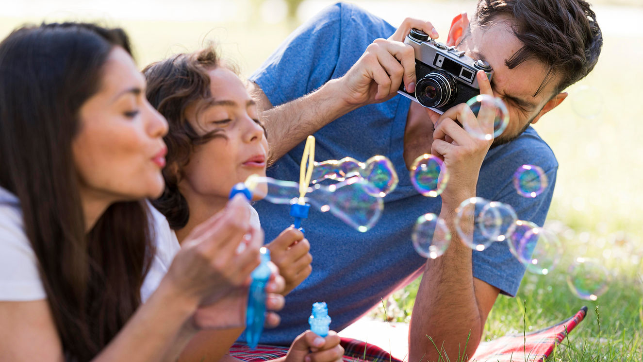 family-having-fun-park-while-blowing-bubbles.jpg
