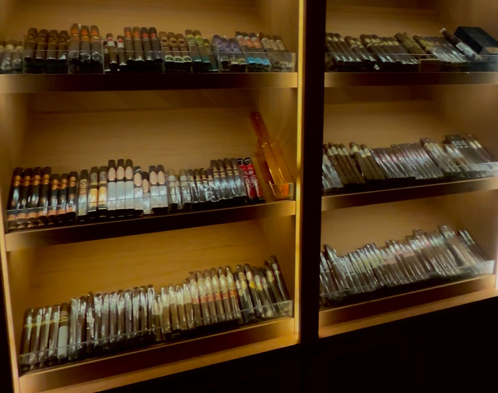 Walk-in cigar humidor in Las Vegas with neatly arranged premium cigars on wooden shelves, illustrating cigar lounge etiquette and cigar culture while traveling.