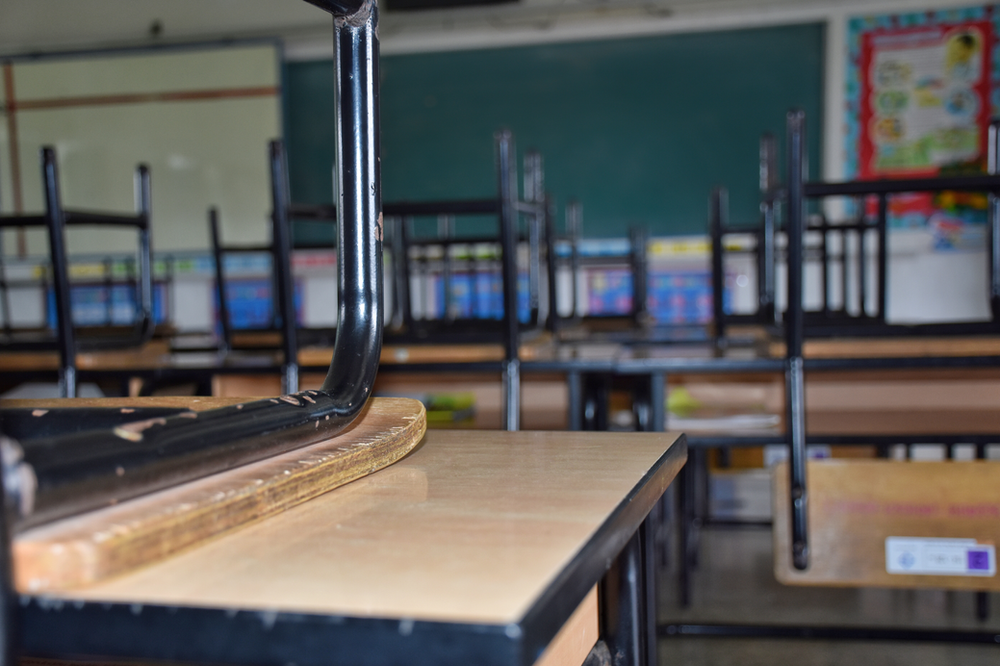 Photo of a school with chairs on the tables