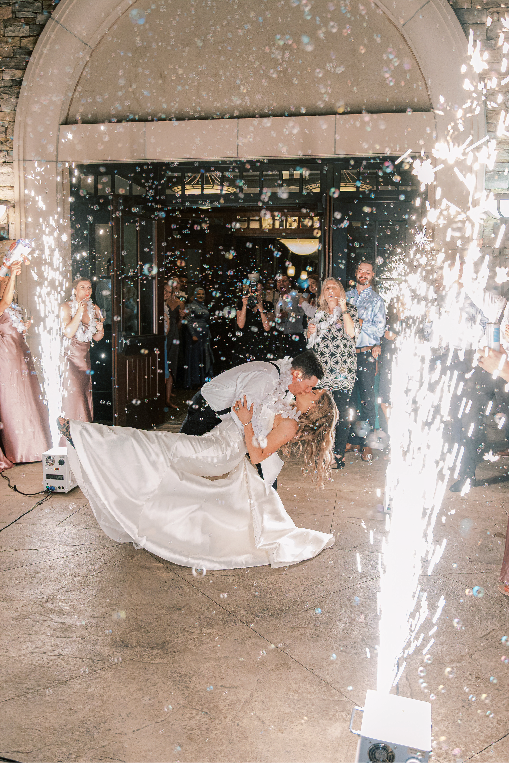 The Bride and the Groom dipped and kissed during their send off with the cold sparks 