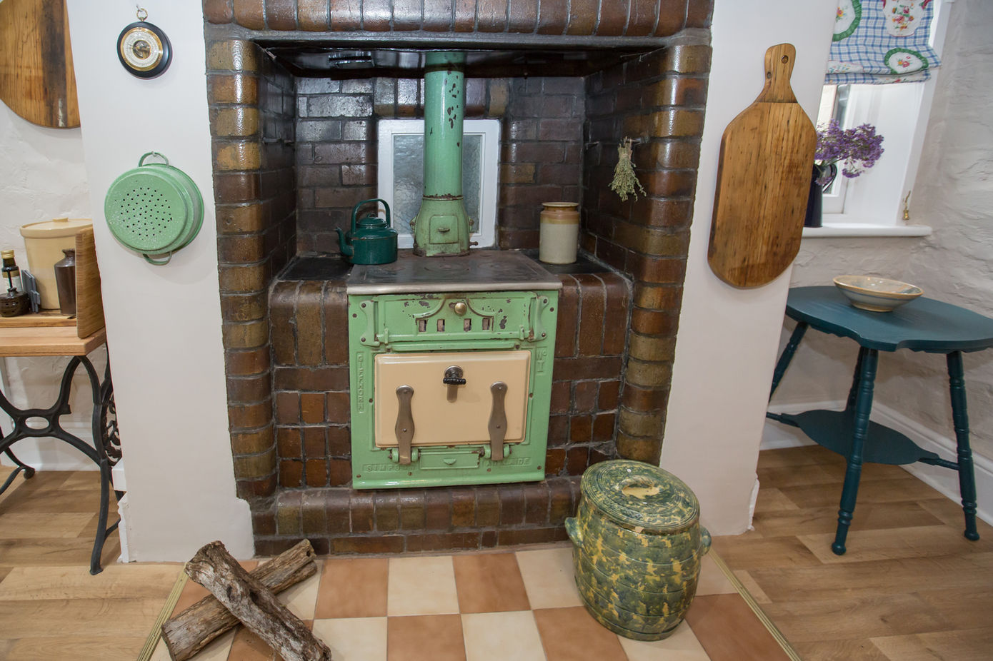 Vintage wood stove in the Burra House kitchen, adding rustic charm to your South Australian heritage getaway experience.
