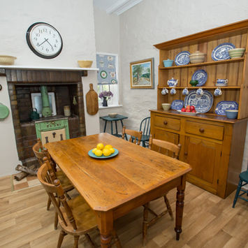 Burra House's spacious eat-in kitchen features modern appliances and essential amenities.