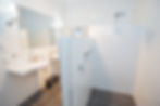 Spacious bathroom with a walk-in shower, toilet, and double hand basins at Burra Heritage Accommodation, blending modern amenities with heritage charm.