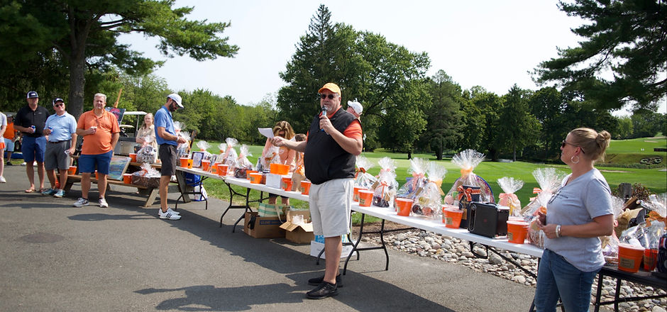 Mark's brother, Jim, announcing the start of the annual golf outing