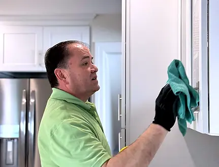 Hopeful Employee Cleaning Kitchen