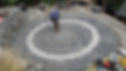 Final touches to the circular cobblestone paving
