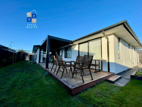 Finished installation with shade pergola over a kwila deck