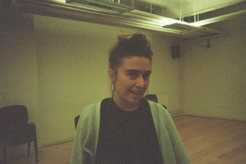 Mel winks towards the camera.