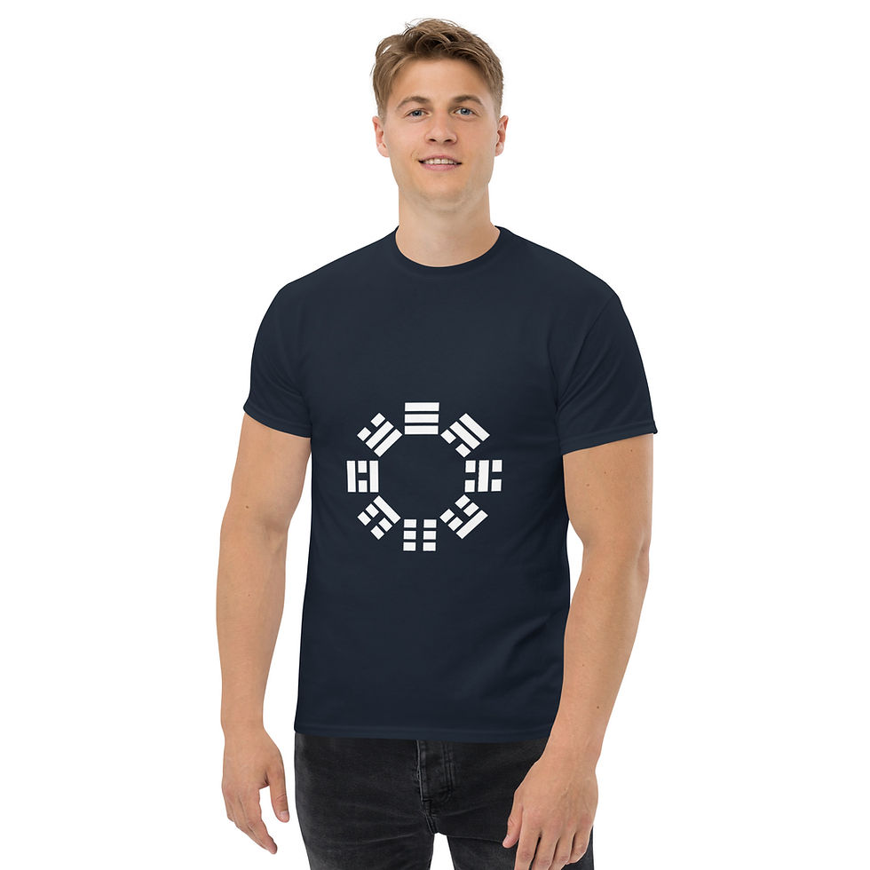 Man wearing a navy t-shirt with a white I-Ching symbol.