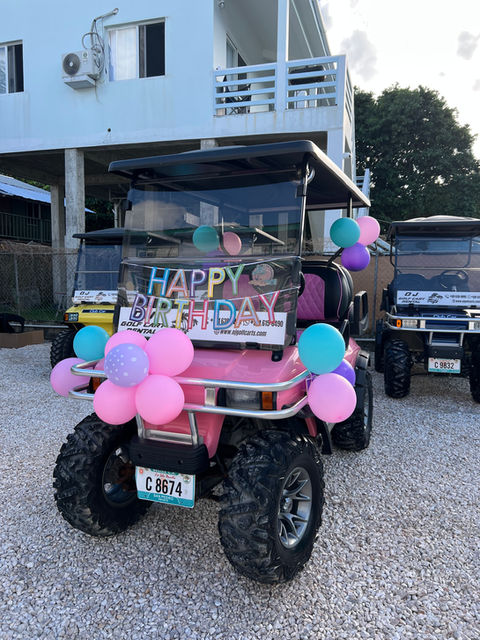 Pink Golf Cart with balloons
