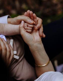 Mother father daughter hands all together