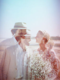 Double exposure of a wedding couple looking at each other