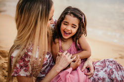 Sunset in Camp Cove of mother and daughter hugging and laughing