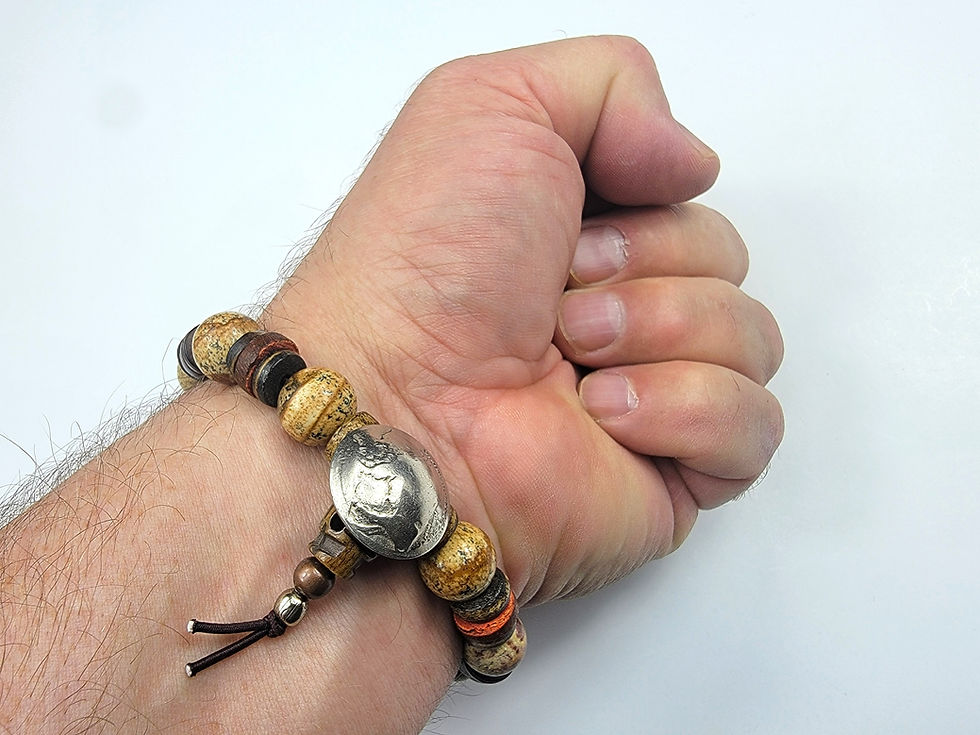 Thumbnail: Bottom view photograph of a man's wrist wearing the Islands To Highlands Yellowstone Bracelet.