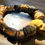Thumbnail: Photograph of the Islands To Highlands Death Valley Bracelet on an antique desk.