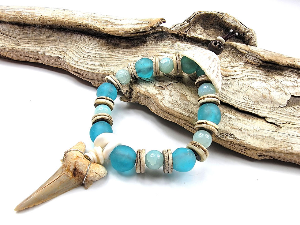 Thumbnail: Photograph of the Islands to Highlands Mighty Maldives Bracelet on a piece of driftwood.