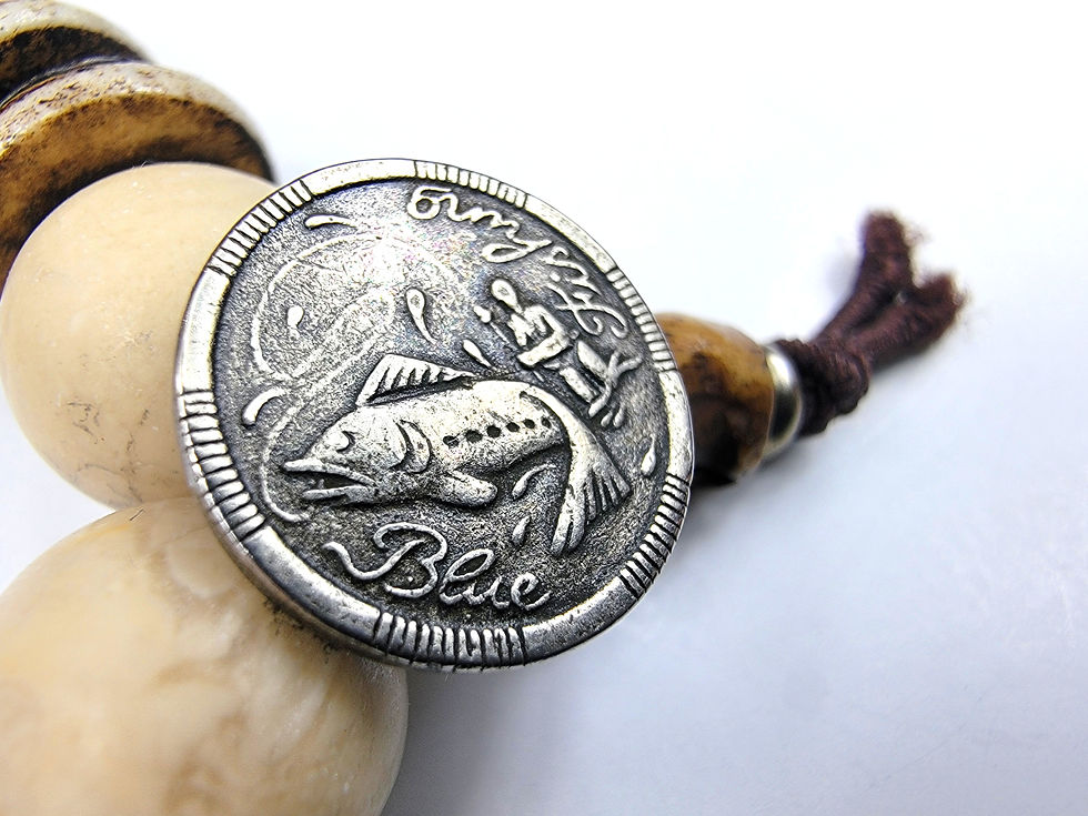 Thumbnail: Close-up photo of the Vintage Blue Fly Fishing Button on the Islands To Highlands Spanish Creek Bracelet.