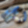 Photogrph of the Islands To Highlands Antibes Bracelet and product card on driftwood.