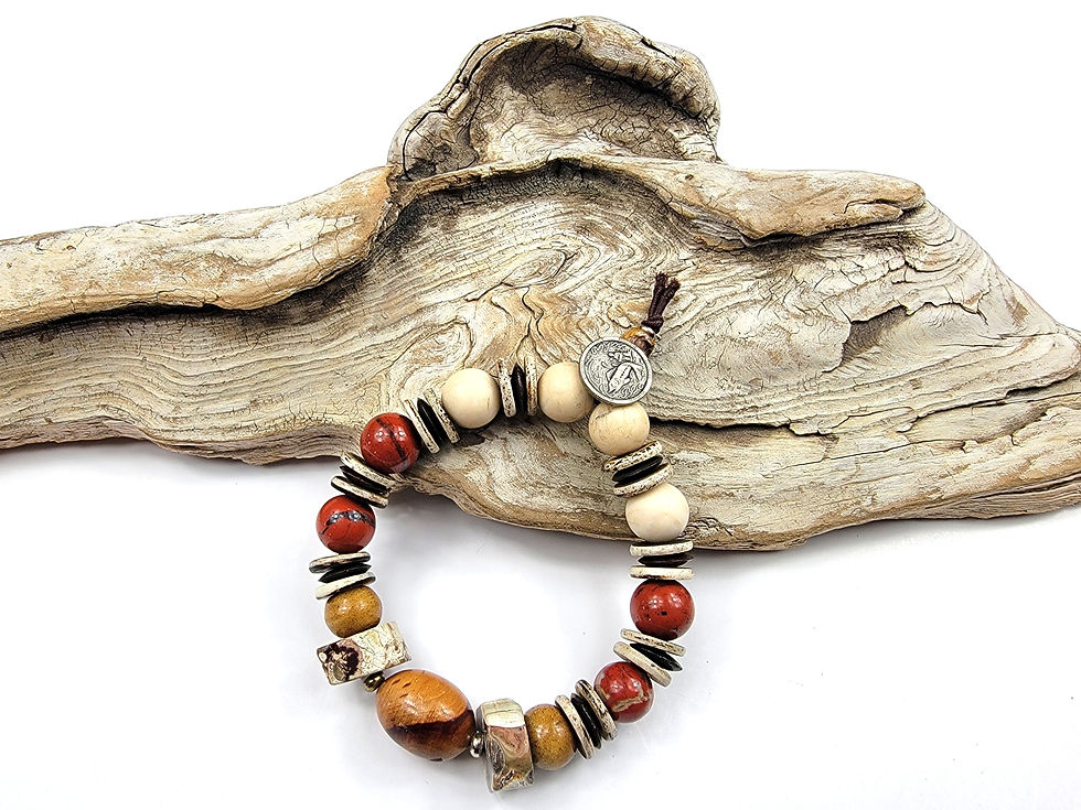 Thumbnail: Photo of the islands To Highlands Spanish Creek Bracelet on a piece of driftwood.