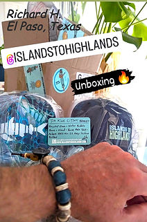Photo of a man in El Paso, Texas who has unboxed a package of Islands To Highlands merchandise.