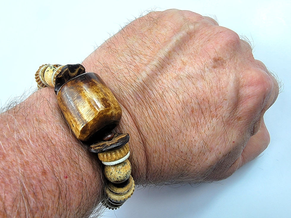 Thumbnail: Photo of a man's wrist wearing the Islands To Highlands Gobi Desert Bracelet.