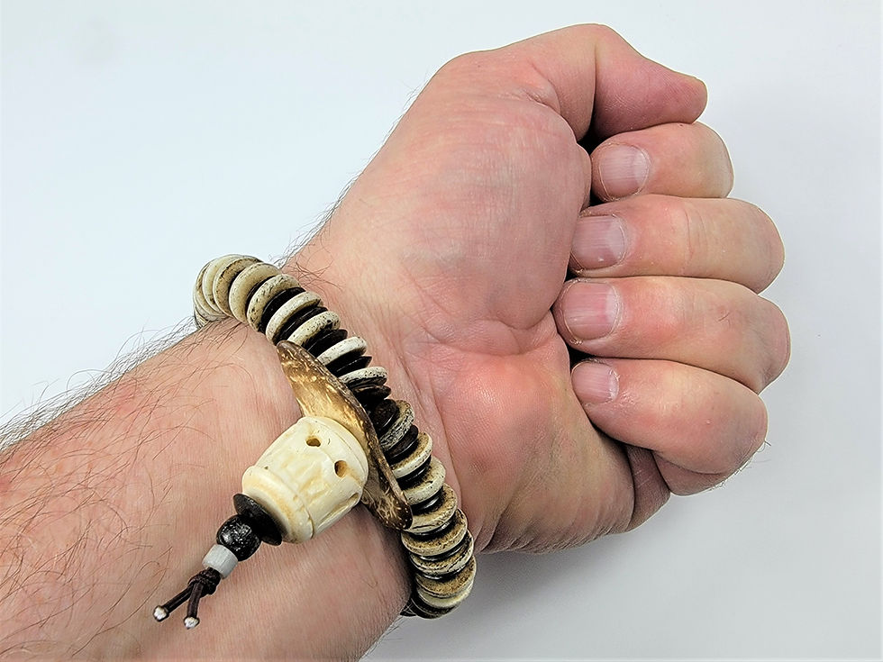 Thumbnail: Bottom view photo of a man's wrist wearing the Islands To Highlands Sailing To Nantucket Bracelet