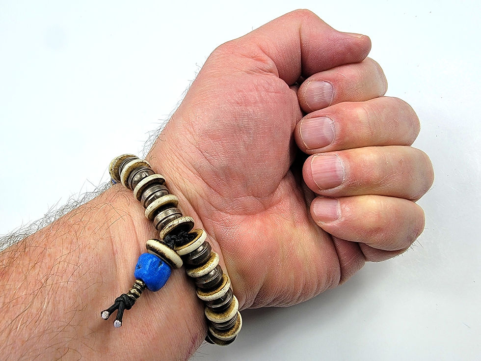 Thumbnail: Bottom view photo of a man's wrist wearing the Islands To Highlands Tunis Bracelet.