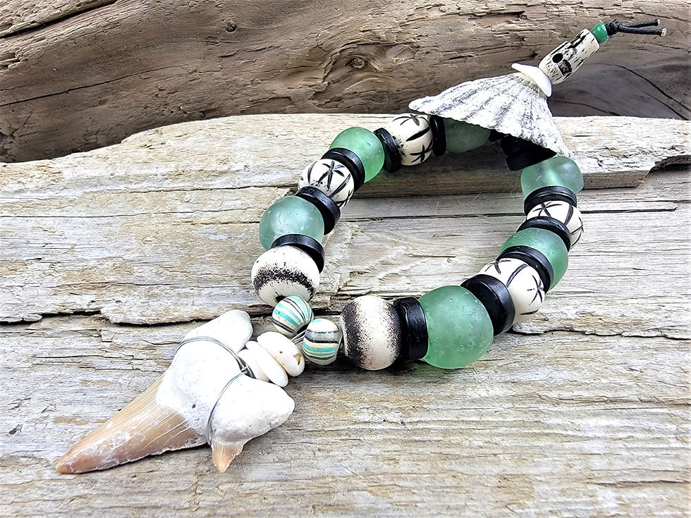 Thumbnail: Photograph of the Islands To Highlands Shark Tooth Down The Cape Bracelet.