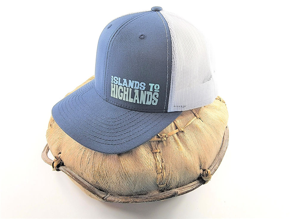 Thumbnail: Photograph of the Islands To Highlands iH Pacific Cap on a coconut husk basket..