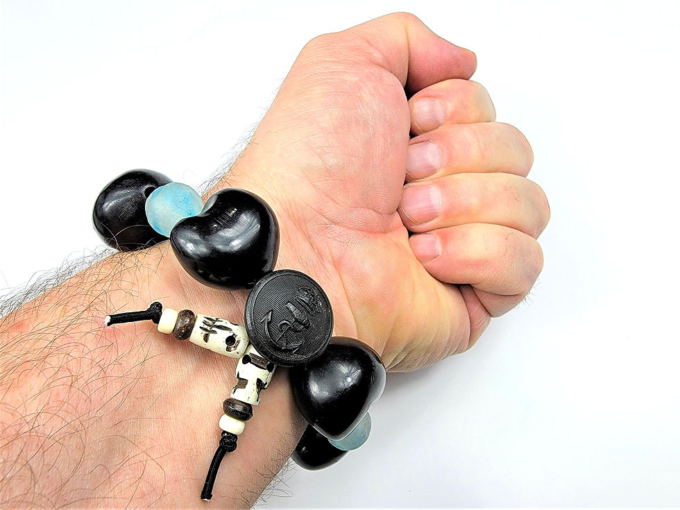 Thumbnail: Bottom view photograph of a man's wrist wearing the Islands To Highlands Pitcairn Island Bracelet.
