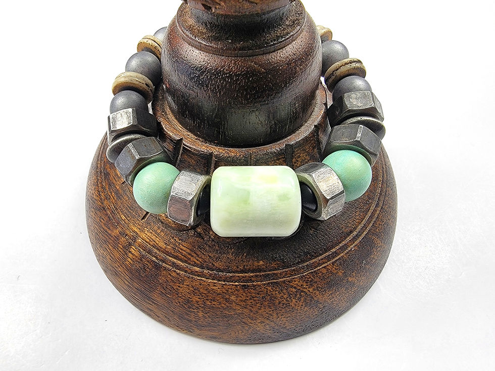 Thumbnail: Photo of the Islands To Highlands Pensacola Cadillac Bracelet on an antique desk.