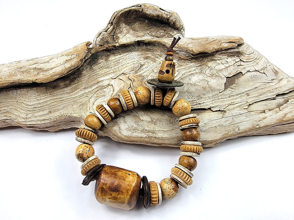 Thumbnail: Photo of the Islands To Highlands Gobi Desert Bracelet on a piece of driftwood.
