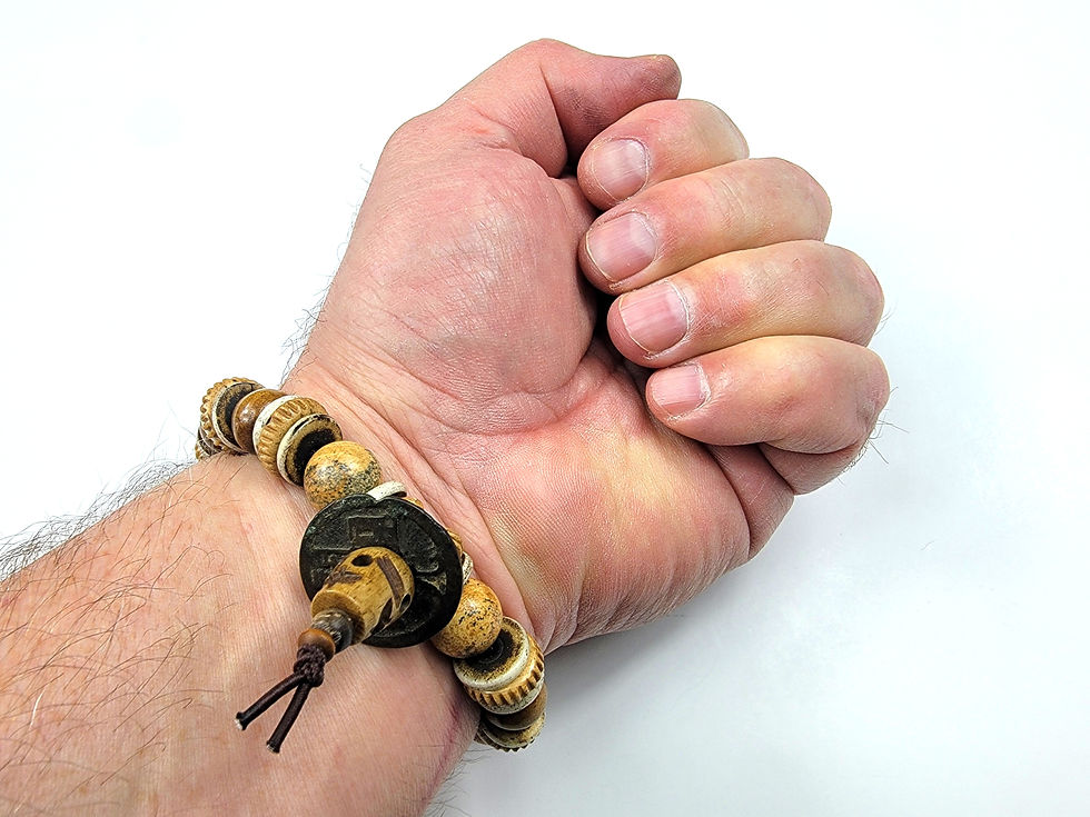 Thumbnail: Bottom view photo of a man's wrist wearing the Islands To Highlands Gobi Desert Bracelet.
