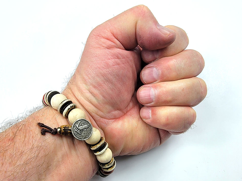 Thumbnail: Bottom view photo of a man's wrist wearing the islands To Highlands Spanish Creek Bracelet.
