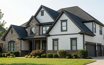 large house after siding and trim was painted