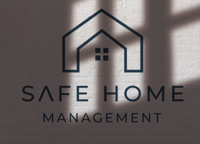 House logo with "SAFE HOME MANAGEMENT" text on a brick wall background. Soft light casts windowpane shadows, creating a calm ambiance.
