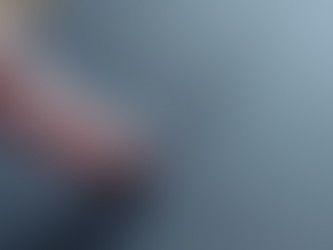 finger wiping dust on a table