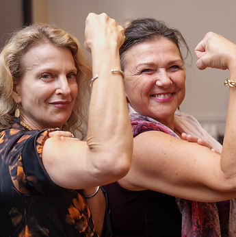 Women showing arms and strength