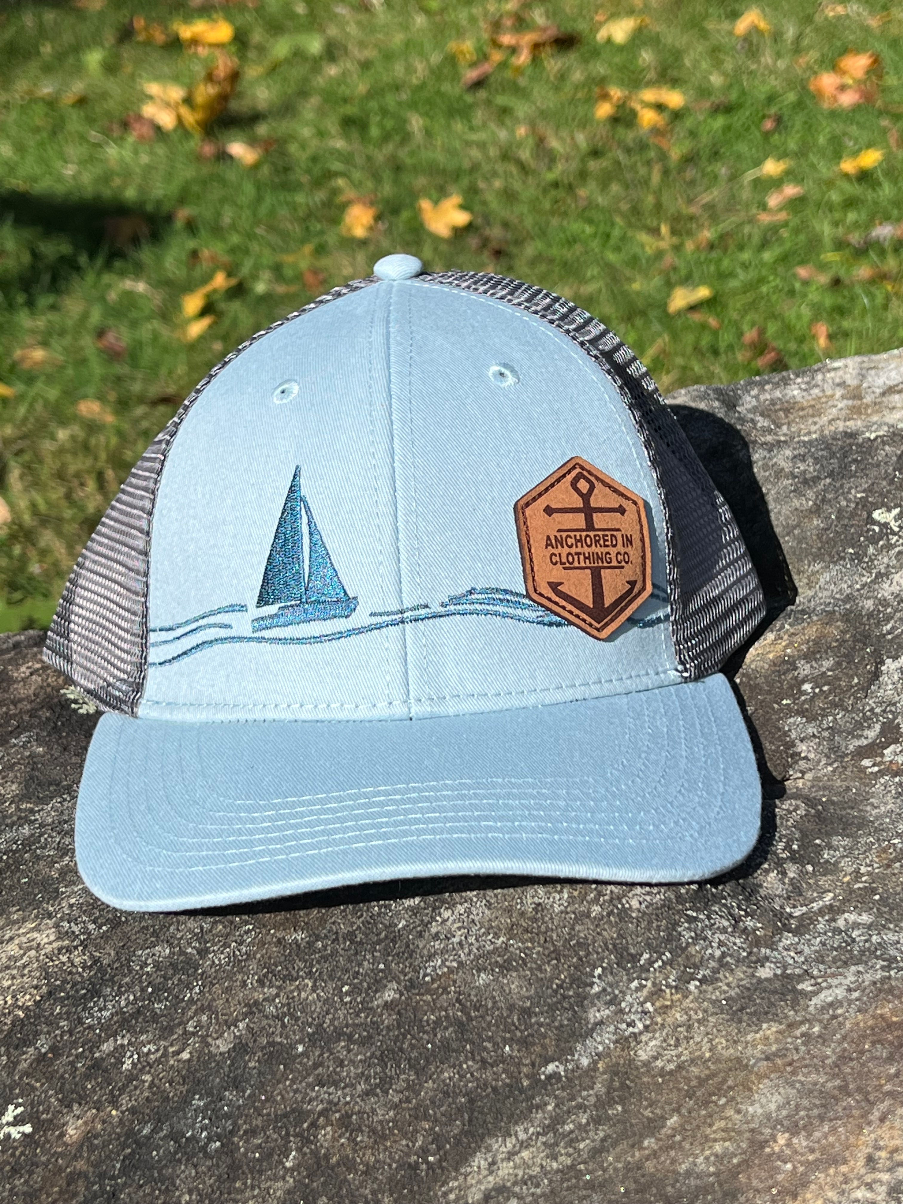 Anchored In Clothing Company - Emboridered Sailboat Trucker Hat
