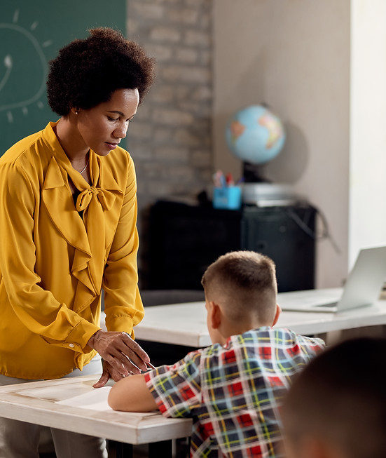 african-american-teacher-assisting-her-students-class-elementary-school.jpg